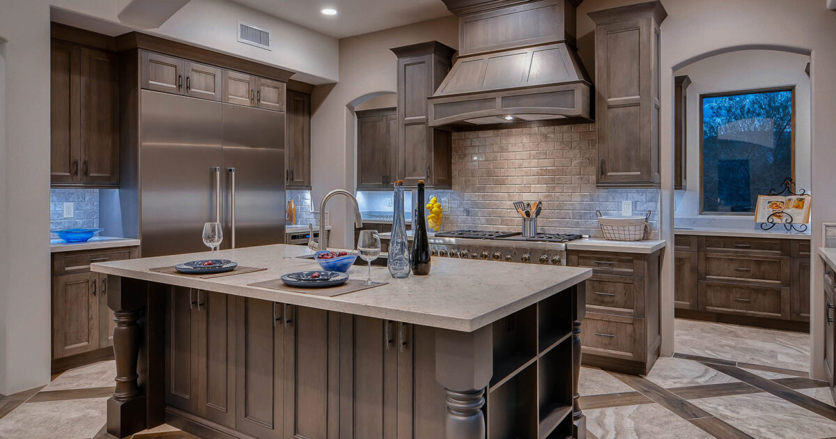 The Sutherland and Savannah door styles are mixed in this gray stained Showplace kitchen